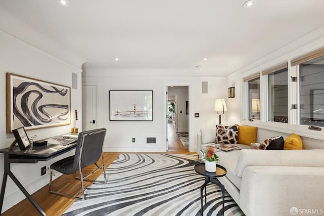 home office featuring crown molding, visible vents, wood finished floors, and recessed lighting