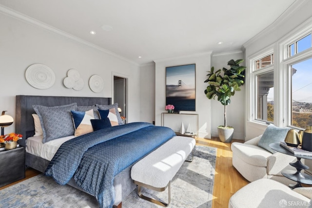 bedroom with crown molding, baseboards, wood finished floors, and recessed lighting