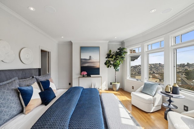 bedroom featuring ornamental molding, recessed lighting, baseboards, and wood finished floors