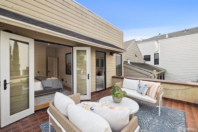 view of patio with outdoor lounge area and a balcony