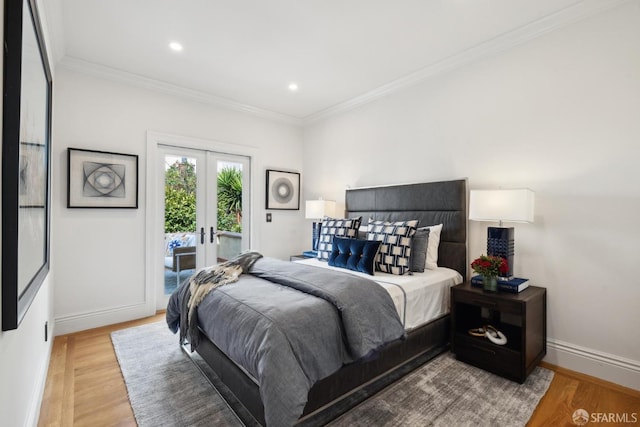 bedroom featuring ornamental molding, access to outside, french doors, and light wood-style floors