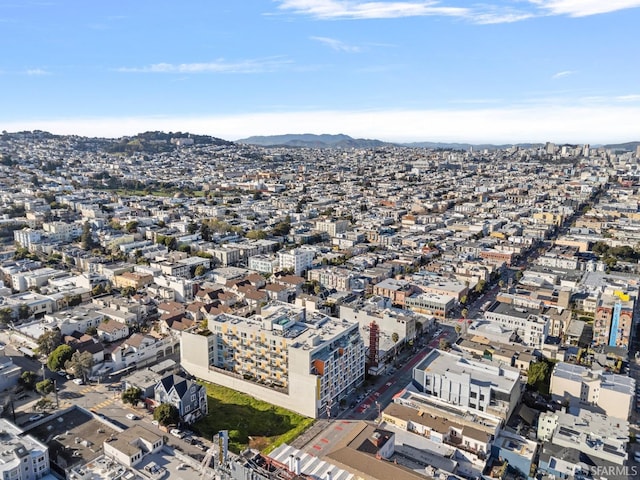 drone / aerial view featuring a view of city and a mountain view