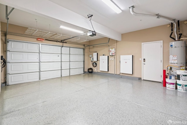 garage featuring a garage door opener and water heater