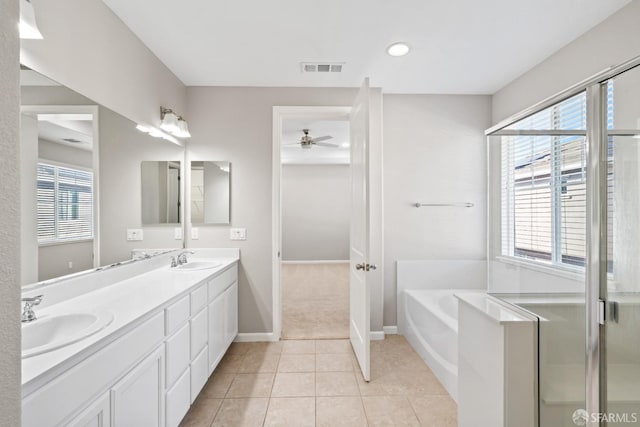 bathroom with tile patterned flooring, vanity, a wealth of natural light, and ceiling fan