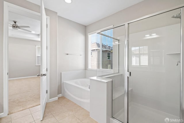 bathroom featuring ceiling fan, plus walk in shower, and tile patterned flooring