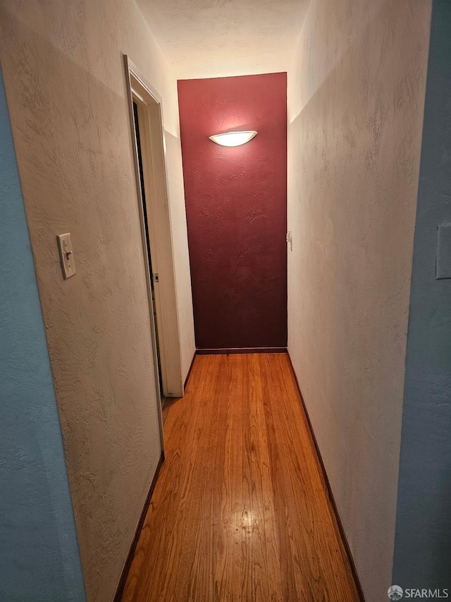 corridor featuring light wood-type flooring