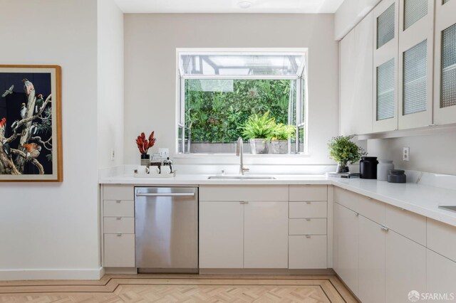 773 Duncan St, San Francisco, CA 94131 - kitchen with dishwasher, a sink, light countertops, glass insert cabinets, and white cabinetry