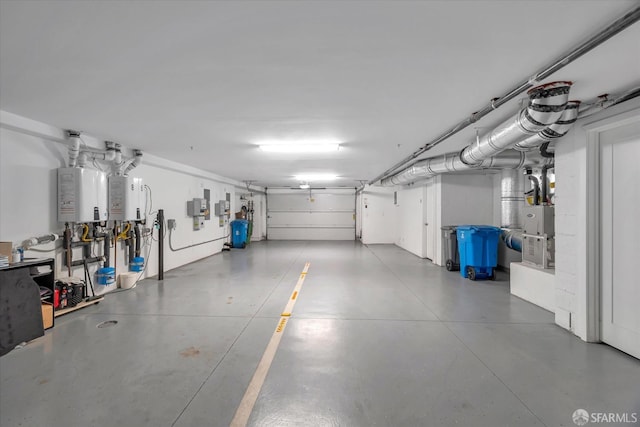 garage with electric panel and water heater