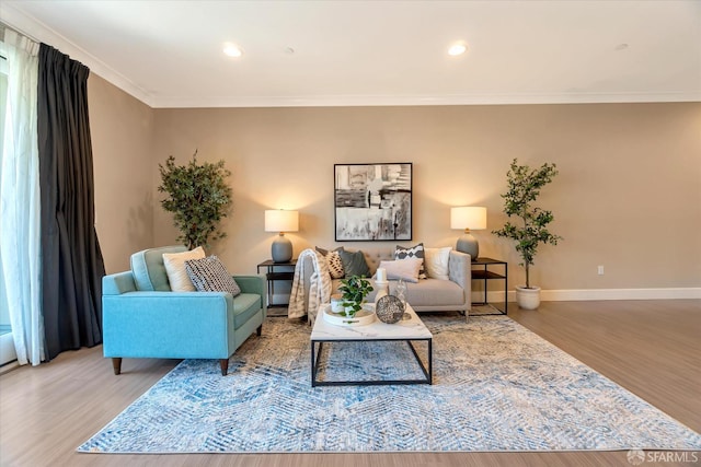 living room with hardwood / wood-style flooring and ornamental molding