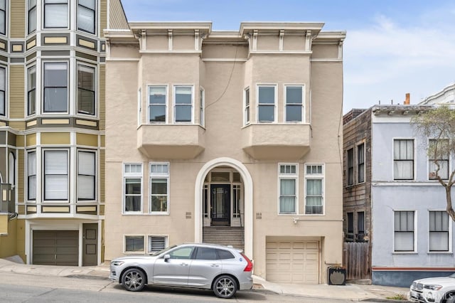 2922 Pine St, San Francisco, CA 94115 - view of property with a garage and stucco siding