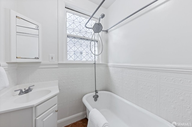 bathroom featuring vanity and a washtub