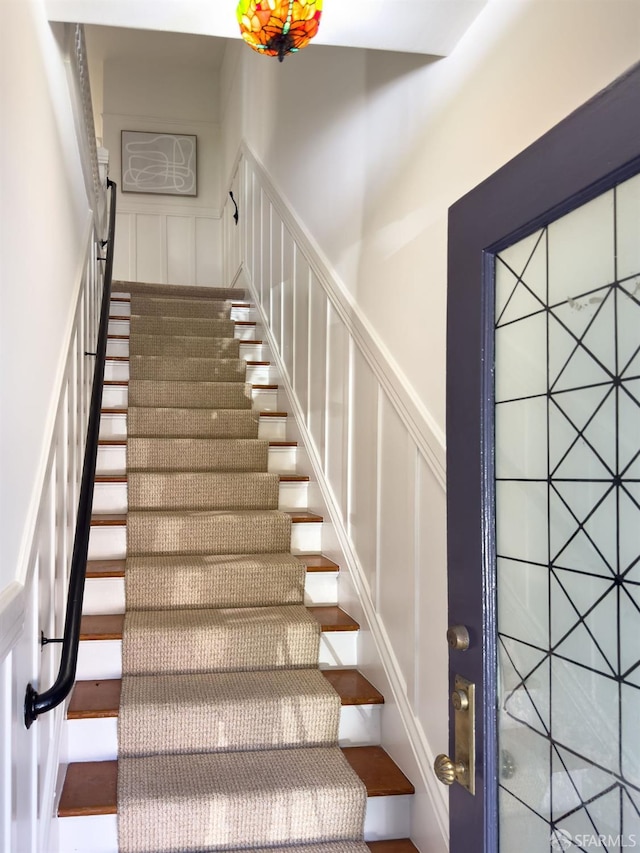 staircase featuring a barn door