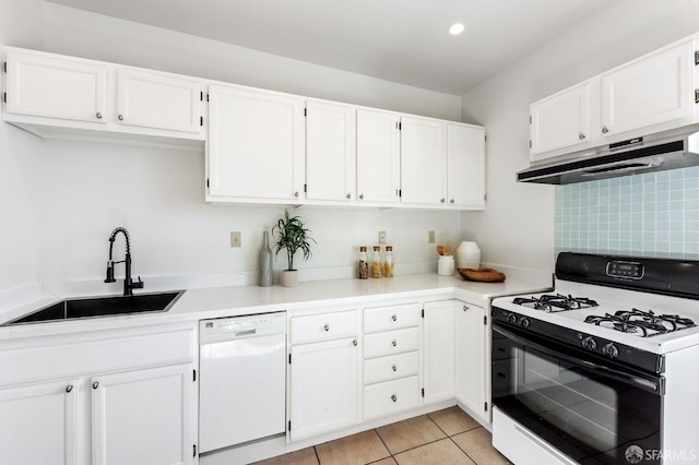 kitchen featuring sink, white cabinetry, and white appliances