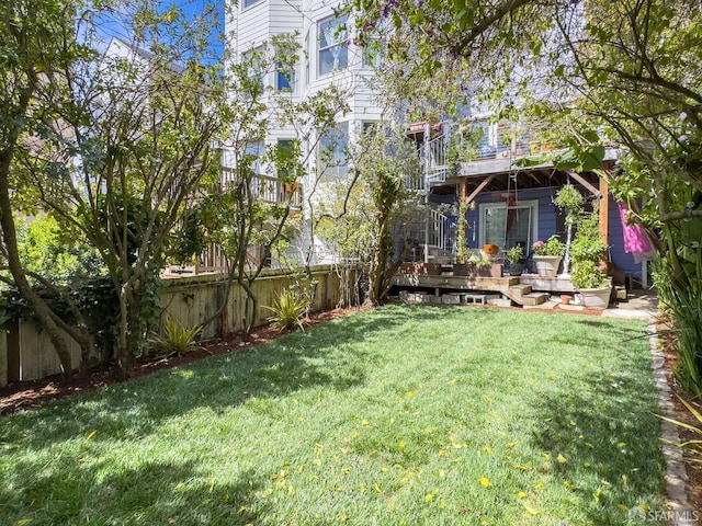 view of yard with a wooden deck