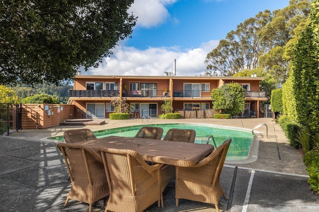 view of swimming pool featuring a patio