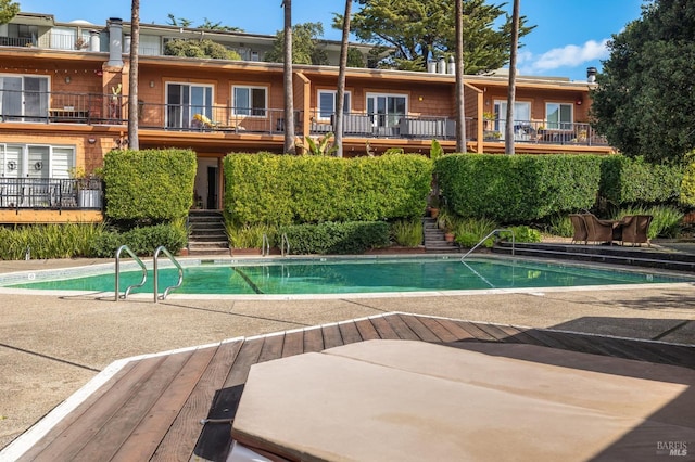 view of swimming pool featuring a patio