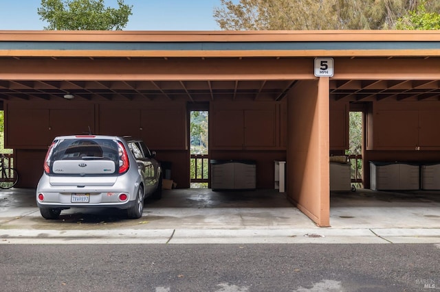 view of parking with a carport