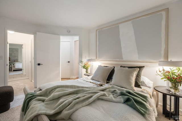 bedroom with light colored carpet