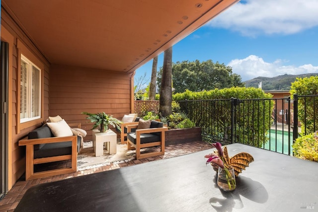 exterior space with a mountain view, an outdoor hangout area, and a patio