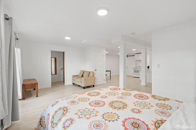 bedroom with light hardwood / wood-style floors