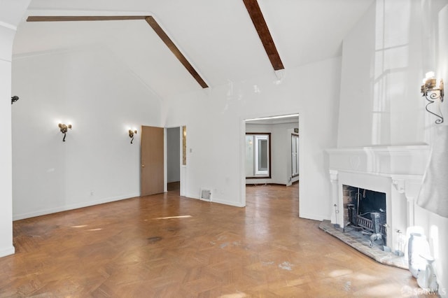 unfurnished living room featuring beam ceiling, high vaulted ceiling, and parquet flooring