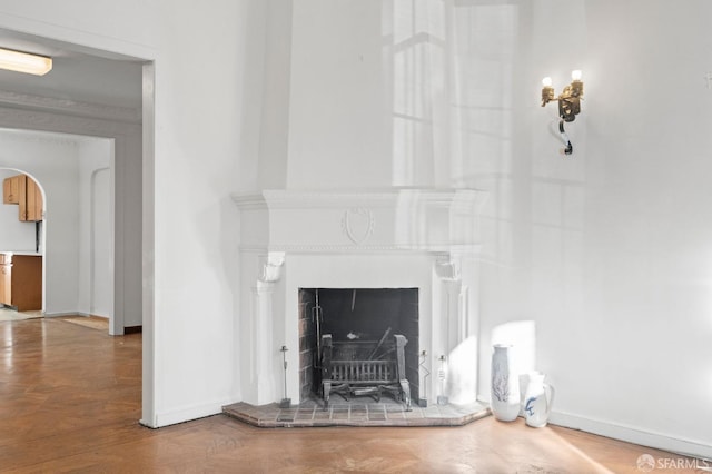 unfurnished living room with hardwood / wood-style floors and a brick fireplace