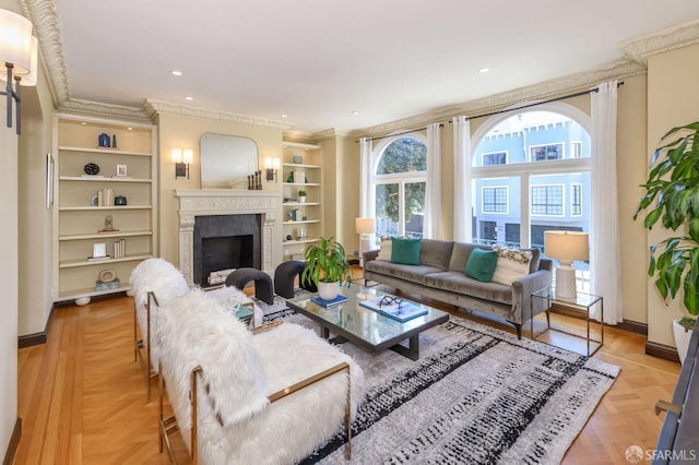 living room with built in shelves, a fireplace, recessed lighting, ornamental molding, and baseboards