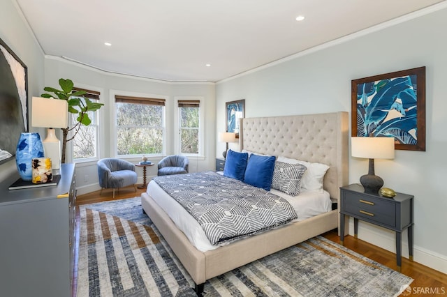 bedroom featuring crown molding, baseboards, wood finished floors, and recessed lighting