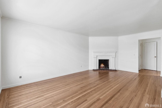 unfurnished living room with light wood-type flooring