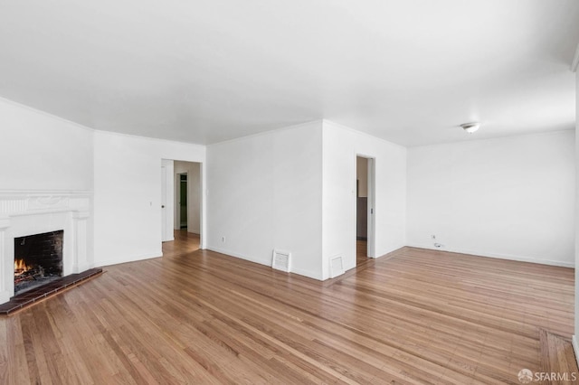 unfurnished living room with light hardwood / wood-style floors