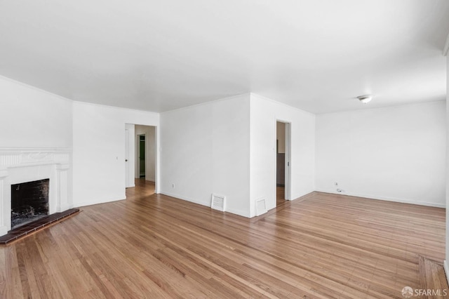 unfurnished living room featuring light wood-type flooring