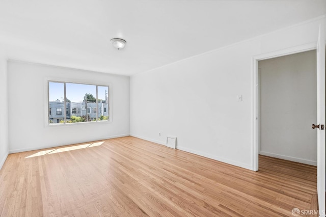 spare room with light wood-type flooring