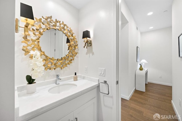 16 Barneson Ave, San Mateo, CA 94402 - bathroom with wood finished floors, vanity, baseboards, and recessed lighting