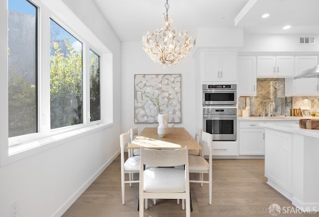 16 Barneson Ave, San Mateo, CA 94402 - dining area featuring a chandelier, light wood-style flooring, and recessed lighting