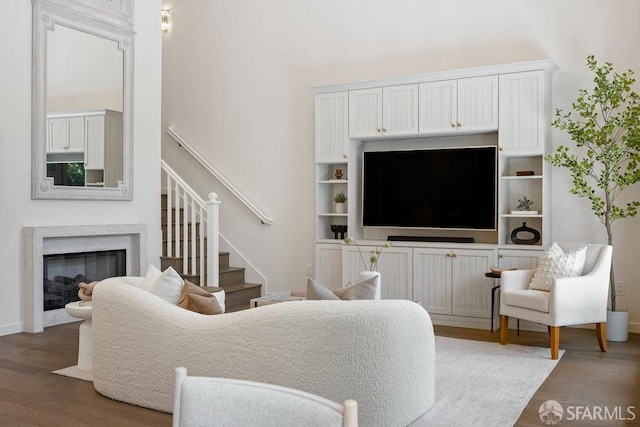 16 Barneson Ave, San Mateo, CA 94402 - living area with wood finished floors, stairway, a high end fireplace, and baseboards