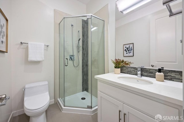 16 Barneson Ave, San Mateo, CA 94402 - bathroom featuring toilet, vanity, a stall shower, tile patterned flooring, and baseboards