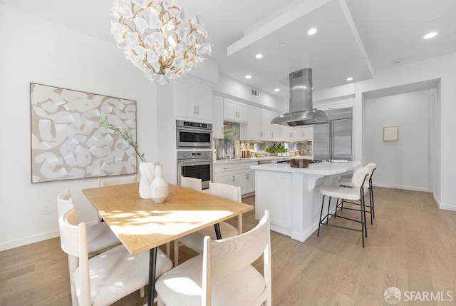 16 Barneson Ave, San Mateo, CA 94402 - dining area featuring light wood finished floors, a chandelier, and recessed lighting
