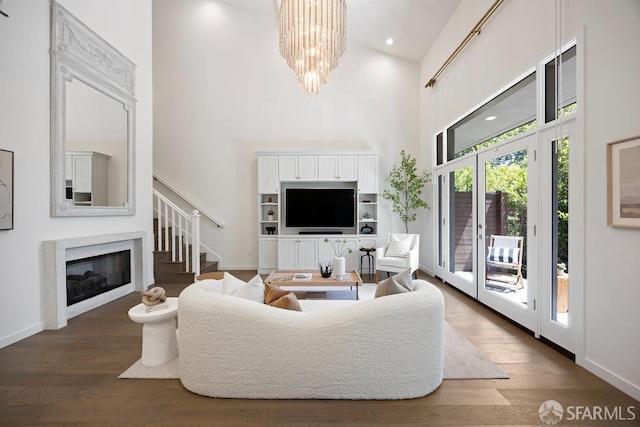 16 Barneson Ave, San Mateo, CA 94402 - living room with a towering ceiling, a high end fireplace, stairs, wood finished floors, and a chandelier