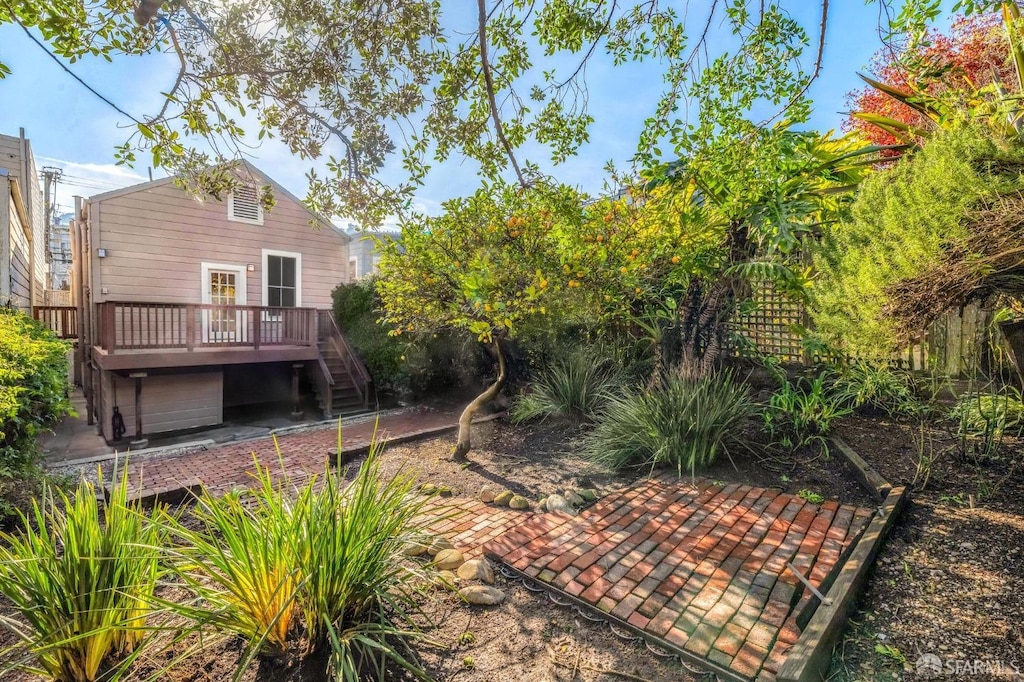 rear view of property with a wooden deck