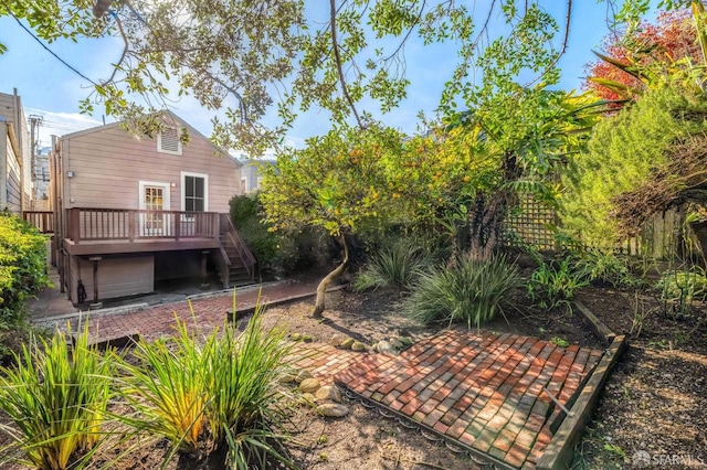 rear view of property with a wooden deck