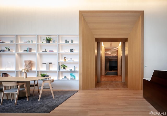 dining space with hardwood / wood-style flooring