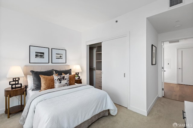 carpeted bedroom featuring a closet