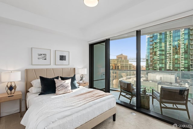 carpeted bedroom featuring access to exterior