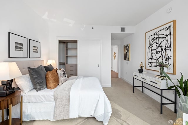 carpeted bedroom featuring a closet