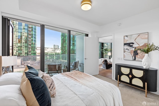 carpeted bedroom featuring access to outside