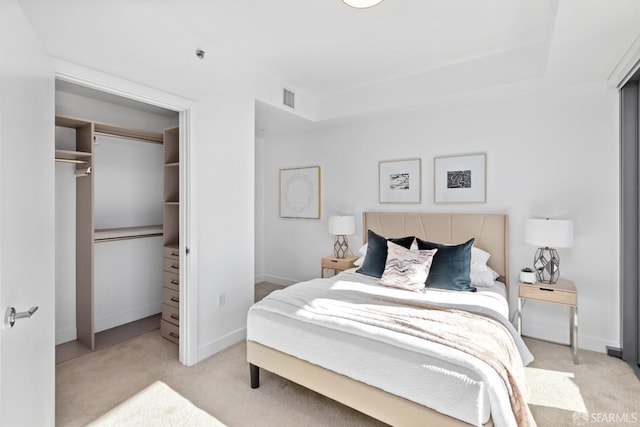 carpeted bedroom featuring a closet