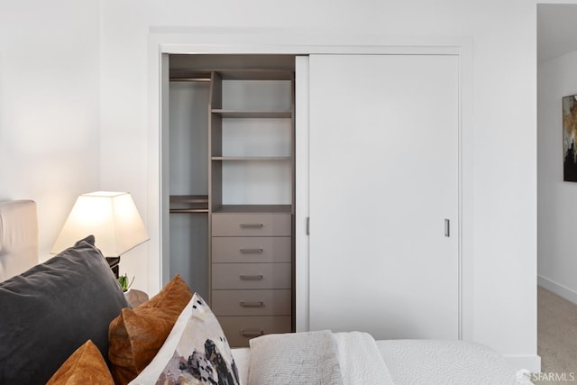 carpeted bedroom featuring a closet