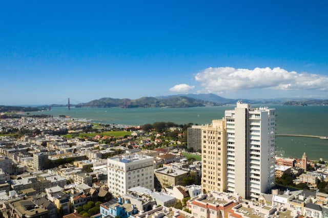 birds eye view of property featuring a water and mountain view