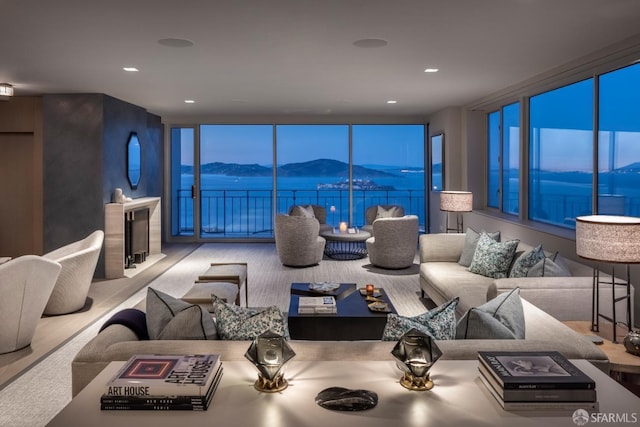 carpeted living room with a mountain view