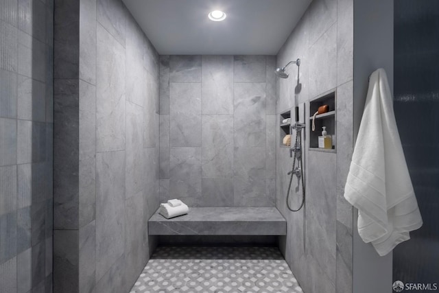 bathroom with a tile shower